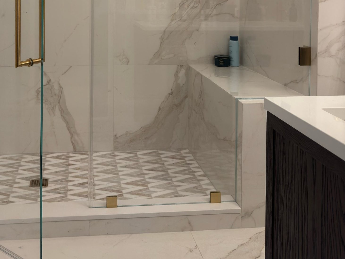 Marble shower bench and mosaic floor
