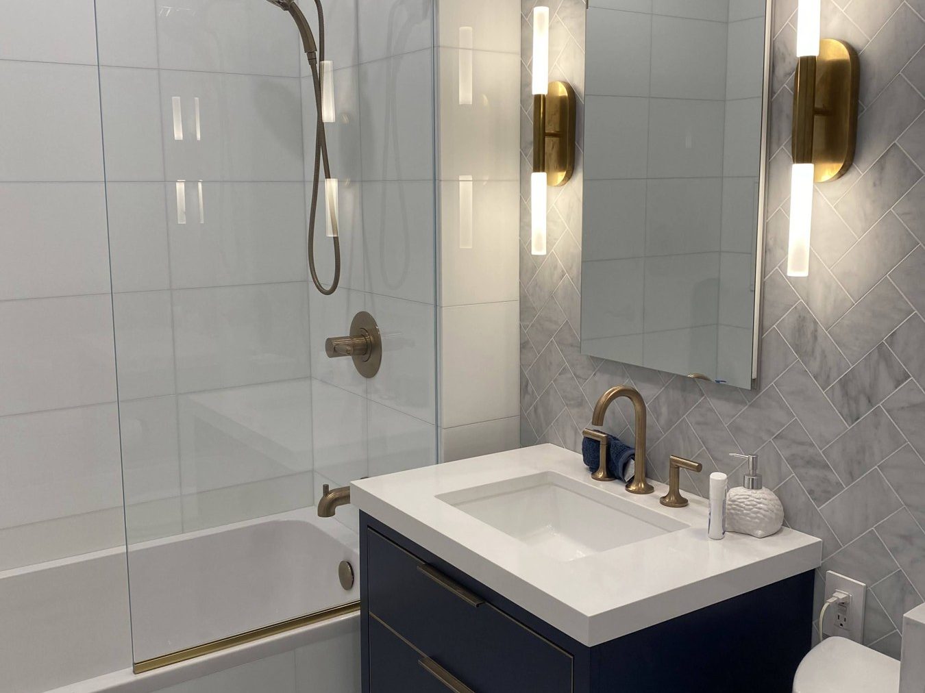 Navy vanity and brass fixtures